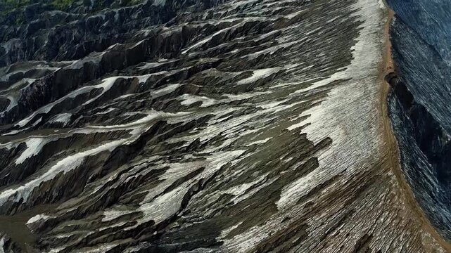 Lateral drone move over Mount Bromo dunes with final reveal of the volcanic crater. 