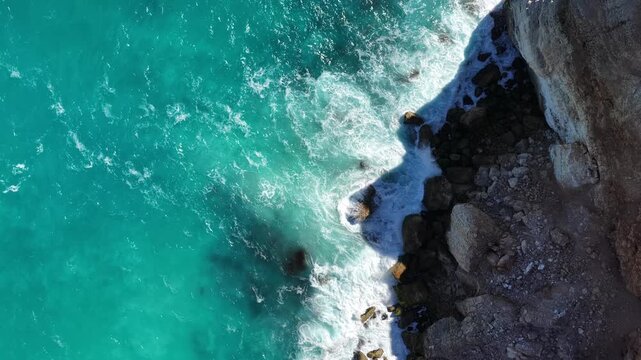 Nullarbor Plain, South Australia &ndash; 4K aerial drone footage of turquoise ocean waves crashing against rugged rocky shore and coastal cliffs