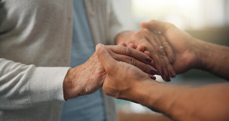 Old woman, caregiver and holding hands in nursing home with support, respect or compassion for grief. Senior person, worker and trust in retirement center with empathy, kindness or volunteer service.