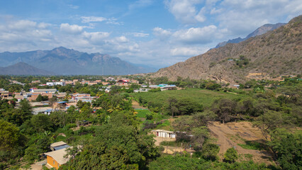 Obraz premium Aerial drone panoramic natural landscapes of Lambayeque, Peru, featuring forests, agricultural fields, and rural scenery near main cities and villages, ideal for tourism, marketing and graphic design