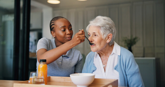 Caregiver, breakfast and feeding senior woman for healthcare, wellness and support in morning. Nurse, elderly person and help with food, eating and assisted living with medical service in home