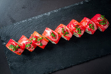 Elegant sushi rolls with vibrant toppings and fresh herbs, a feast for the senses