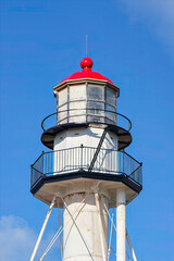 lighthouse tower on a blue sky