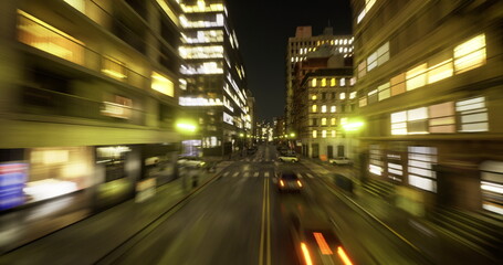 Night city avenue light streaks evoke cinematic motion and urban energy blurred vehicles, illuminated storefronts, asphalt reflections, long exposure effect, © icetray