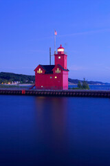 red lighthouse at night