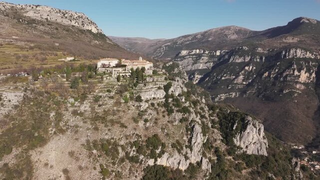European old town on a steep cliff, mountaineous landscape, drone video, Gourdon, France 4K