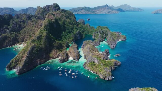Wide aerial shows twin lagoons scale silence, turquoise perfection, Philippines