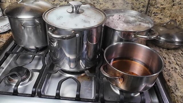 Cooking stew on stove with onoto oil for hallacas in kitchen