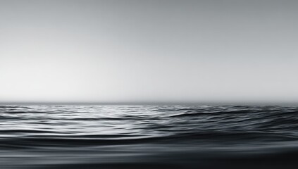 A serene, minimalist seascape with gentle waves under a muted sky