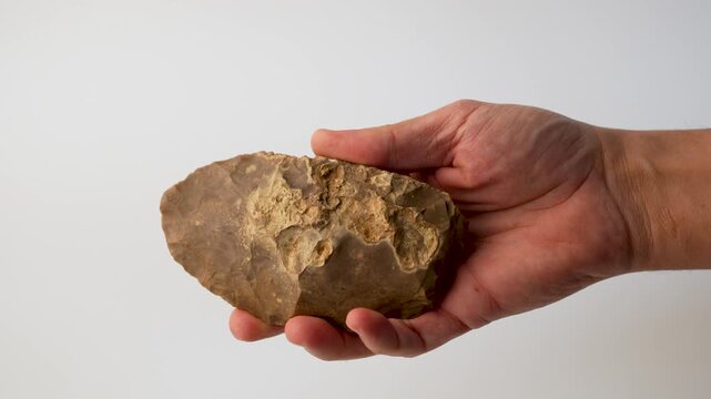 Prehistoric Flint Knife in Hand, Ancient Stone Tool, 4K. white background