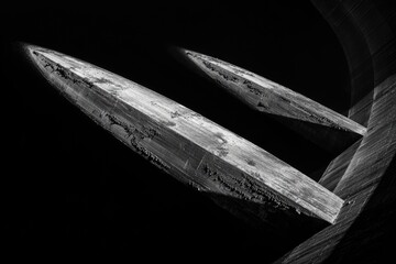 Abstract crystalline structures, sharply detailed, with textured surfaces and dark backgrounds