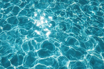 Shimmering sunlit blue water surface with rippling light patterns