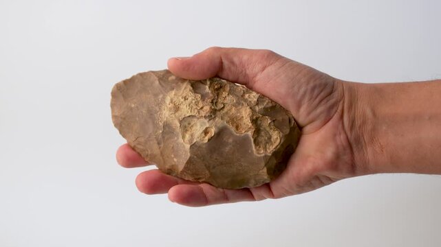 Prehistoric Flint Tool Symbolizing Human Evolution and Early Technology, 4K. Biface tool. Neolithic or Paleolithic