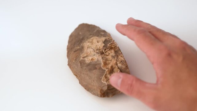 Prehistoric Flint Knife in Hand, Ancient Stone Tool, 4K Video. slow motion