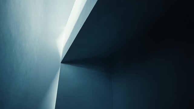 Light creating a strong contrast and geometric shapes on a minimalist architectural surface, emphasizing corners and sharp lines in an abstract, modern design for various backgrounds