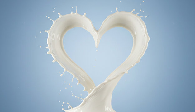 ハート型に弾ける牛乳、青い背景