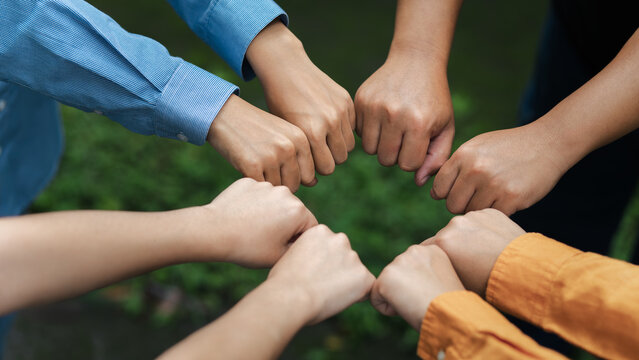 Environmental concept, business people join forces on World Environment Day and global community teamwork the global environment, society and environment CSR and sustainable development.