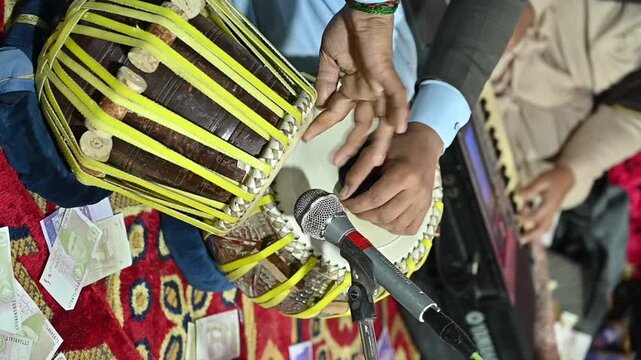 Close up of hands of amazing indian percussion musician performing with tabla in slow motion 4k video