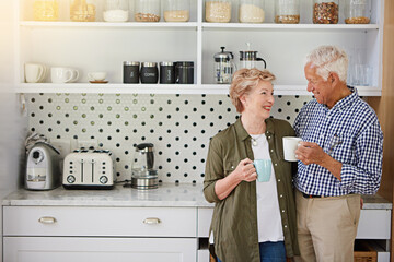 Coffee, love and retirement with old couple in kitchen of home together for bonding or connection....