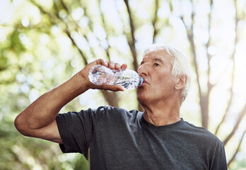 Senior man, drinking water and fitness at park with break, hydration and cardio challenge in...