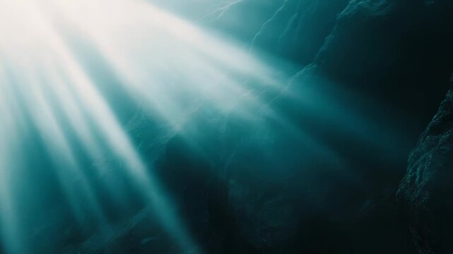 Deep ocean abyss with vibrant sunbeams piercing blue water, illuminating rocky caverns and mysterious depths for a serene, otherworldly underwater scene ideal for exploration themes