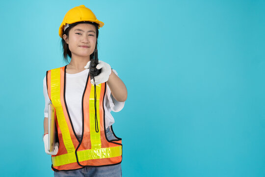 Portrait Engineer Woman Asian Teen with safety reflective vest isolated model using radio pointing