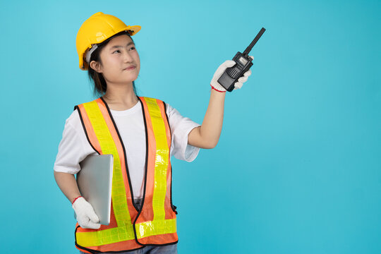 Portrait Engineer Woman Asian Teen with safety reflective vest isolated model using radio pointing