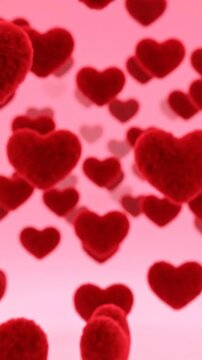 Fluffy red hearts falling background slowly zooming in on a single heart and then out for an advertisement.
