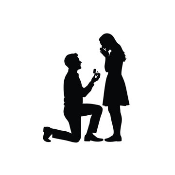 Silhouette of a man proposing to a surprised woman with an engagement ring
