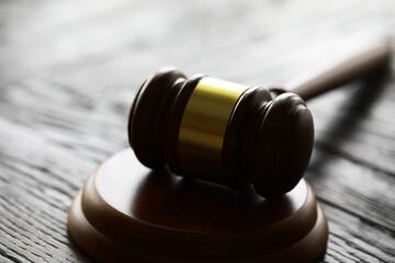 Obraz premium Judges gavel on wooden desk. Law firm concept.