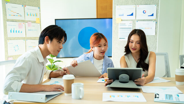 Group of young asian creative business brain storm meeting presentation,discussing roadmap to product launch, planning,strategy,new business development,working with new startup project in office.
