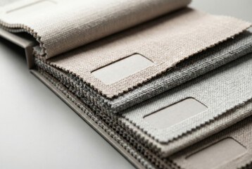 Neutral fabric swatch book for interior design and upholstery