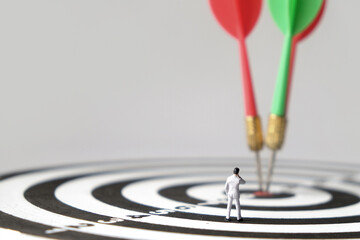 Miniature businessman see all their targets achieved. Business goals and concepts for achieving...