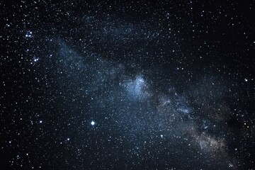 Obraz premium Stunning view of the starry sky showcasing countless bright stars and the Milky Way galaxy over a tranquil night landscape in a remote area