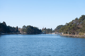Fototapeta premium A tranquil lake reflects the trees and clear sky in Lushan Mountain, Jiangxi China
