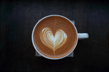 Heart Latte Art in a White Cup on a Dark Surface
