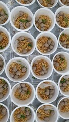 thai food in indonesia.  The neat arrangement of meatball bowls makes you want to eat them.
