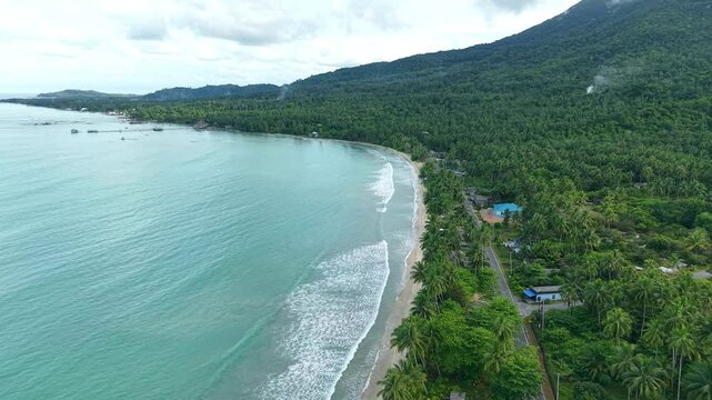 beautiful view of Natuna beach with available waves and mountain background