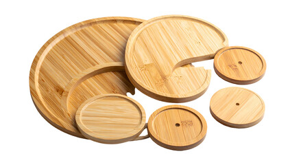 Set of light bamboo serving and decorative pieces arranged against a dark background