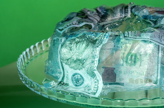 Absurd jelly cake with money concept symbolizing inflation and capitalism