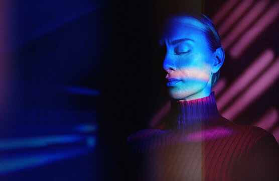 Portrait with neon projection light and virtual reality concept