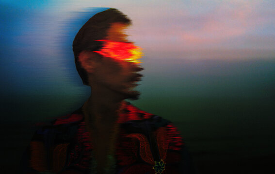 Man wearing VR glasses with glitch effect in cyberspace