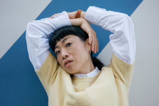 Authentic portrait of stylish woman in casual outfit looking at camera