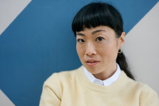 Portrait of an authentic woman in casual outfit looking at camera