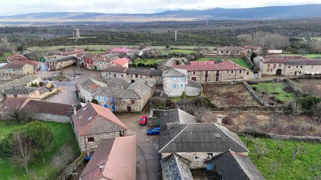 Vertical aerial view over Rabanal del Camino rooftops and fields