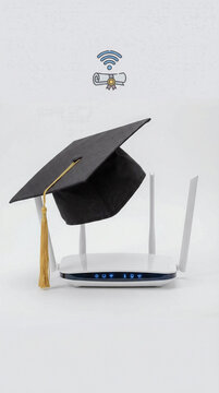Graduation cap on a wireless router signifying achievement in technology