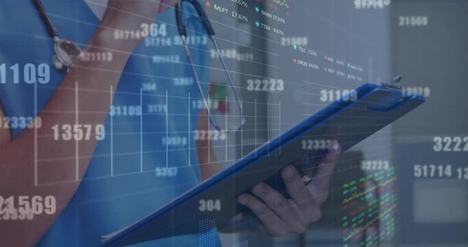 Animation of financial data over midsection of caucasian male doctor making notes