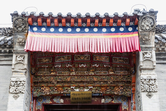 Xining Tibetan Temple Entrance with Traditional Architecture and Stone Carvings