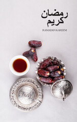 Ramadan background with Dates fruit and Arabic text Ramadan Kareem meaning Blessed Ramadan