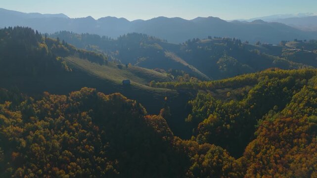 Cinematic Backlit Aerial Flight Over Misty Autumn Layers at Sunset in Transylvania